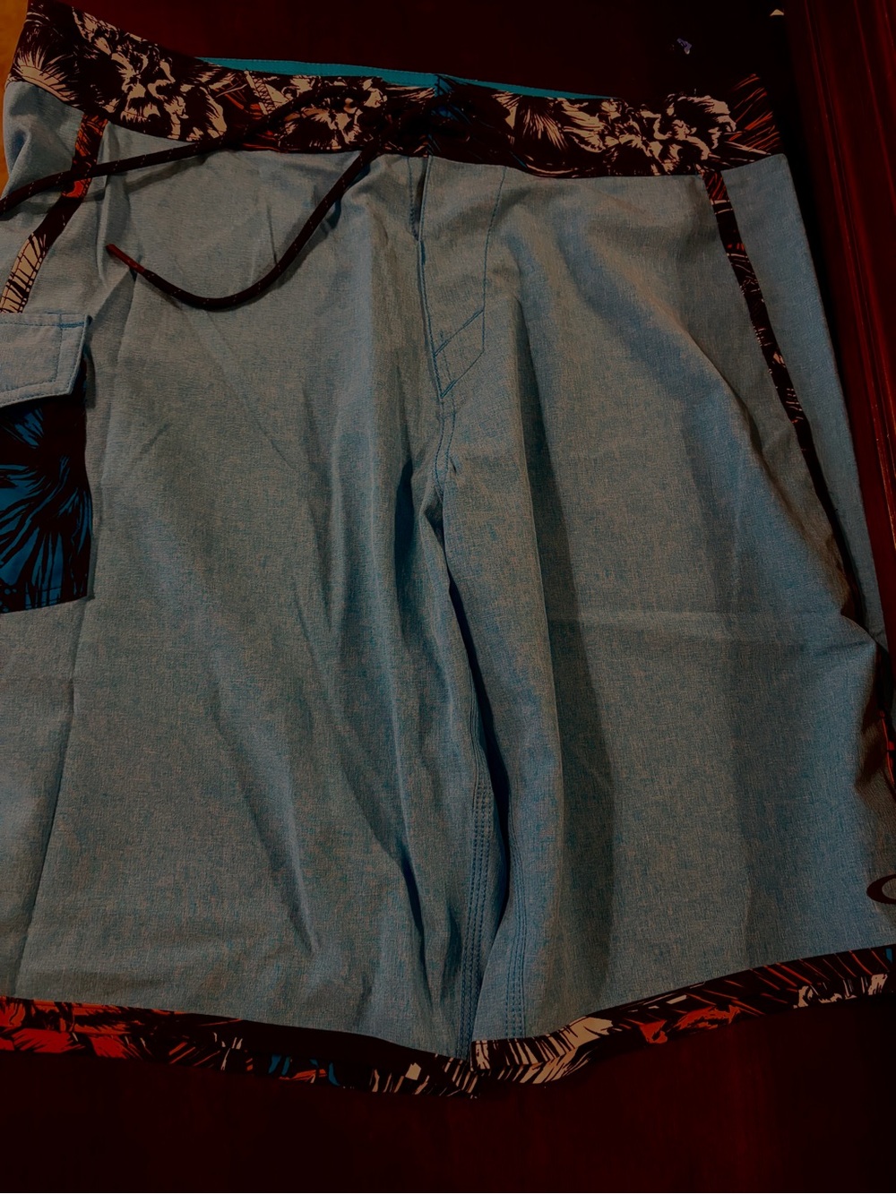 Oakley Light Blue Board Shorts with Black Floral Waistband